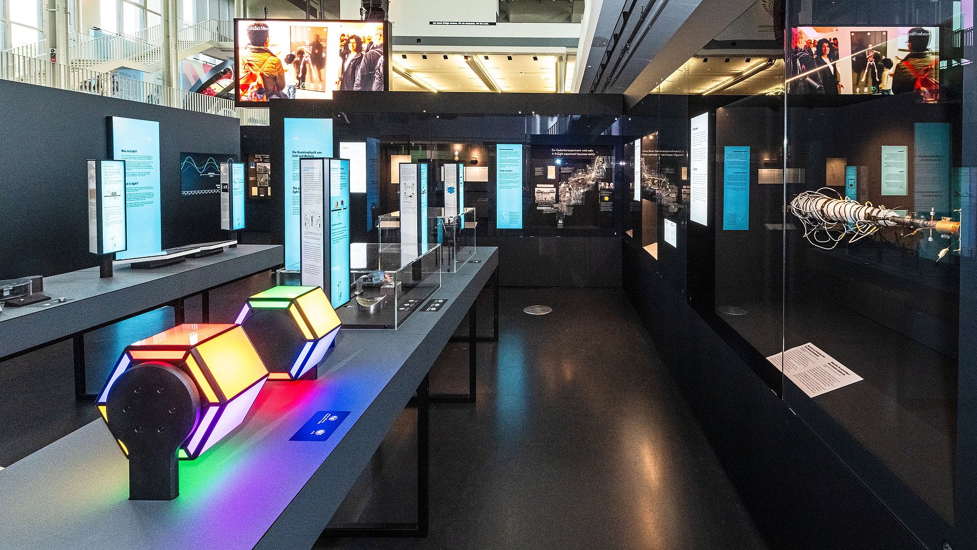 View of the "Light and Matter" exhibition with numerous interactive stations.