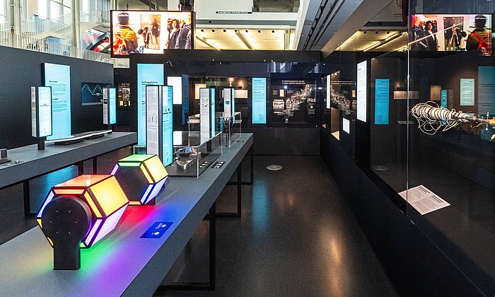 View of the "Light and Matter" exhibition with numerous interactive stations.