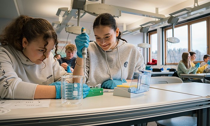 Two girls conducting an experiment at MINTopolis