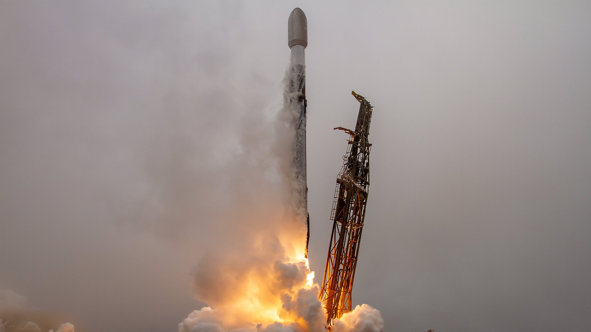 A rocket takes off in the fog