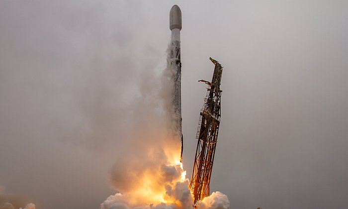 A rocket takes off in the fog