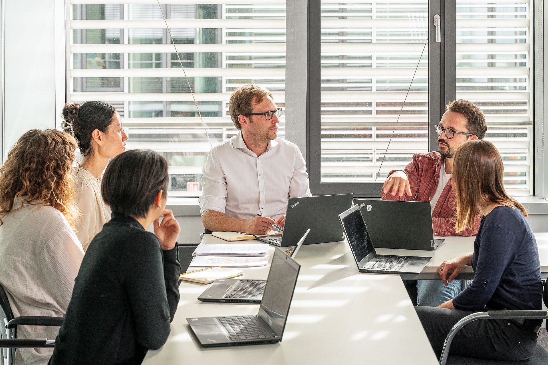 Prof. Michael Laxy (center) and his team, including Karl Emmert-Fees