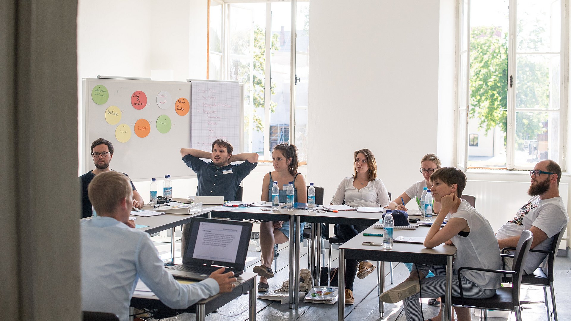 People brainstorming in a seminar room.