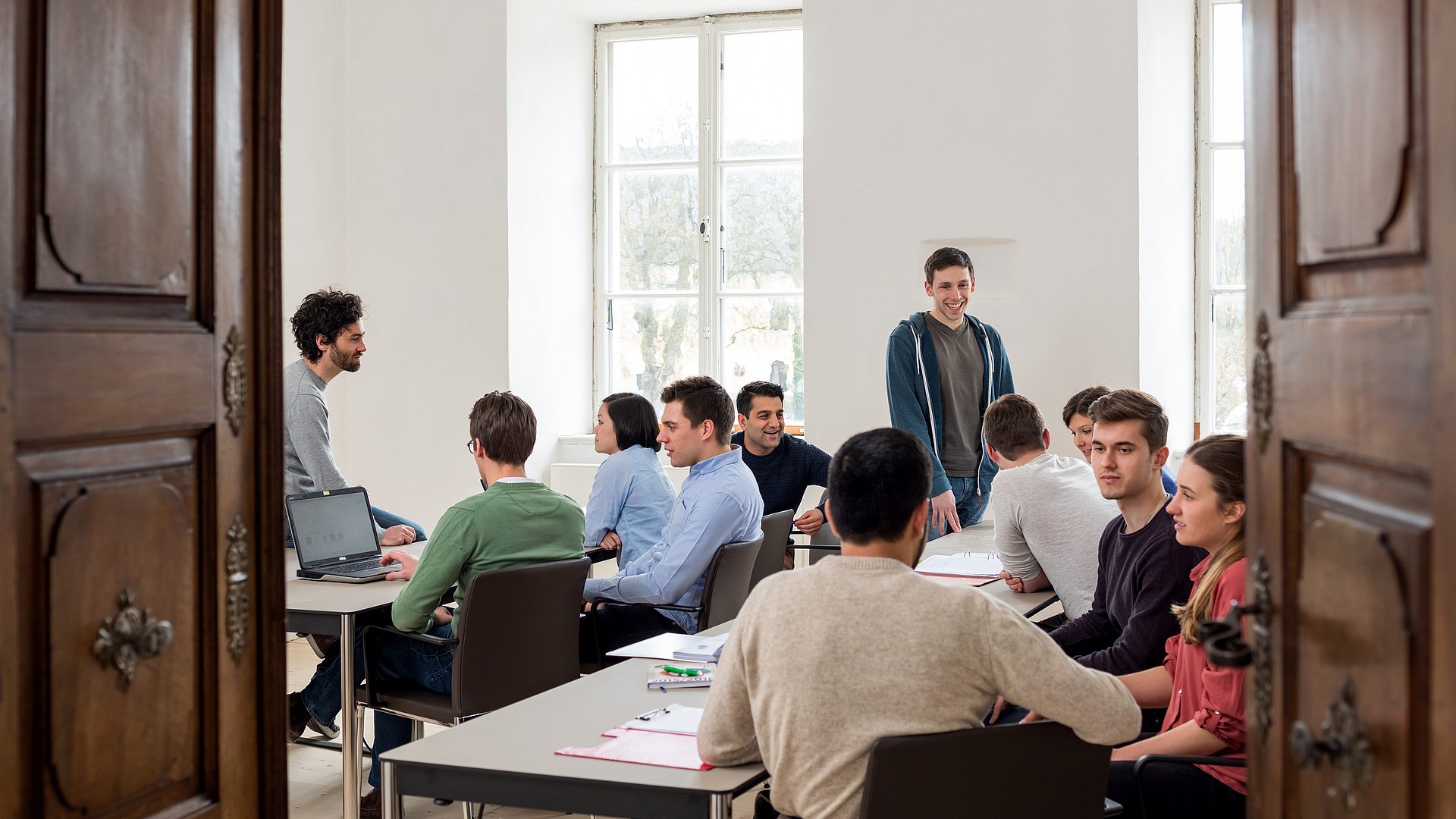 Students sitting together in a seminar room.