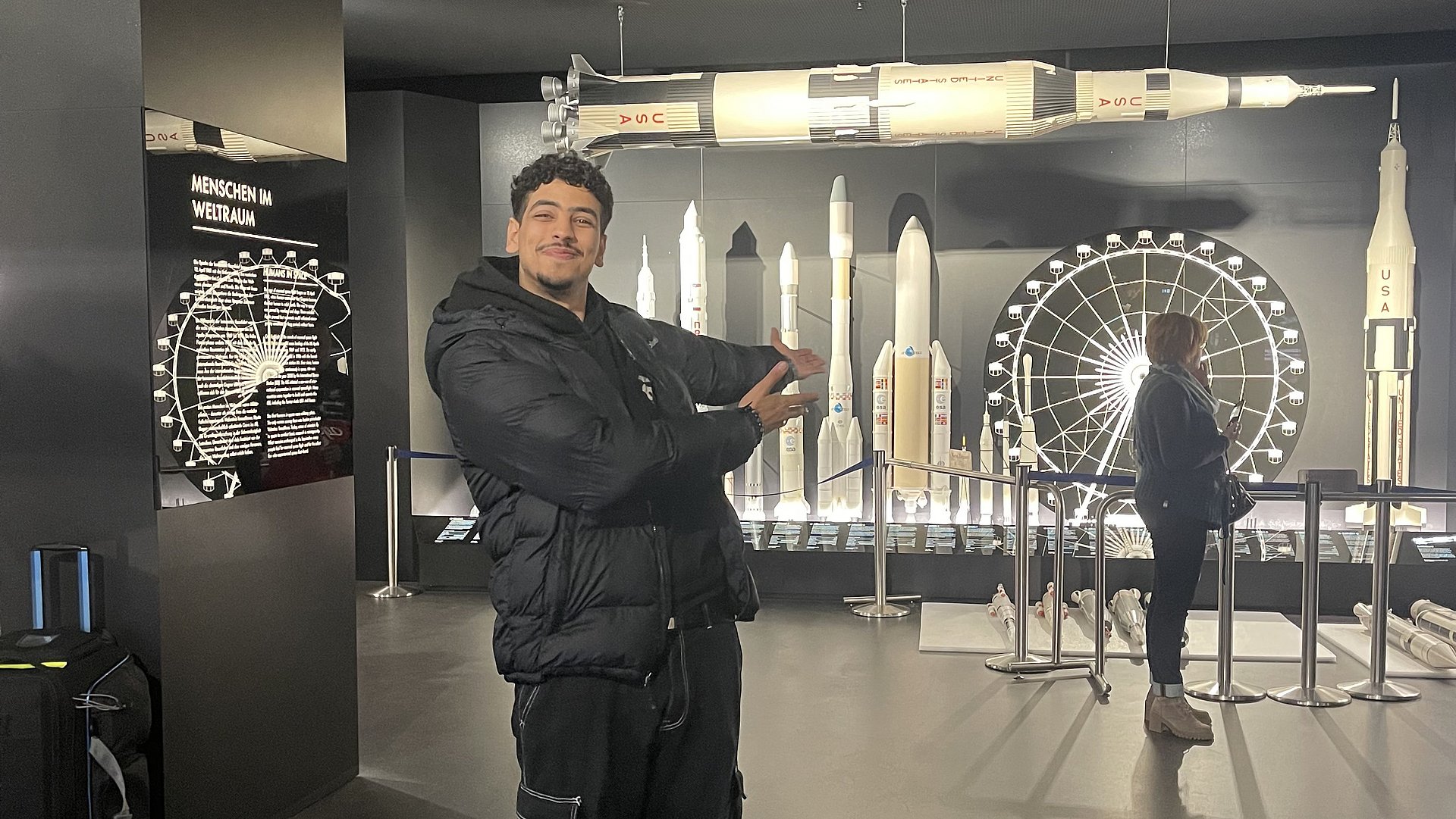 Ilyasse Taame in front of different rocket models