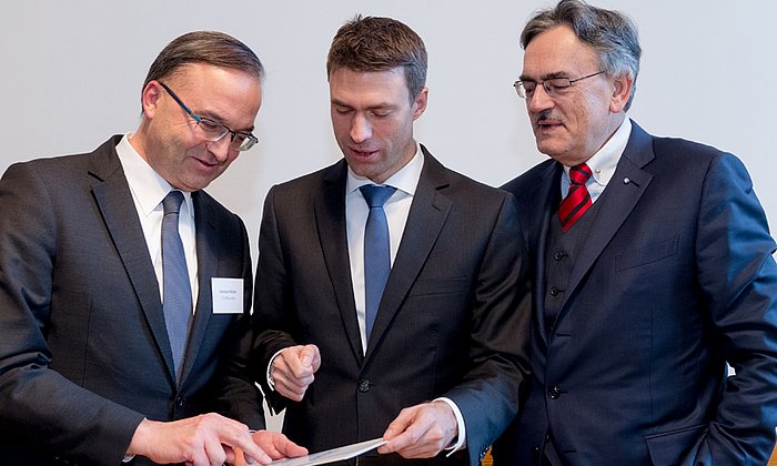 Professor Gerhard Müller, Senior Vice President - Academic and Student Affairs (left), Stefan Müller, Parliamentary State Secretary (center), and  Prof. Wolfgang A. Herrmann