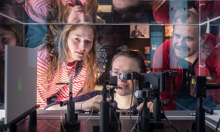 Students at the “Light and Matter” exhibition