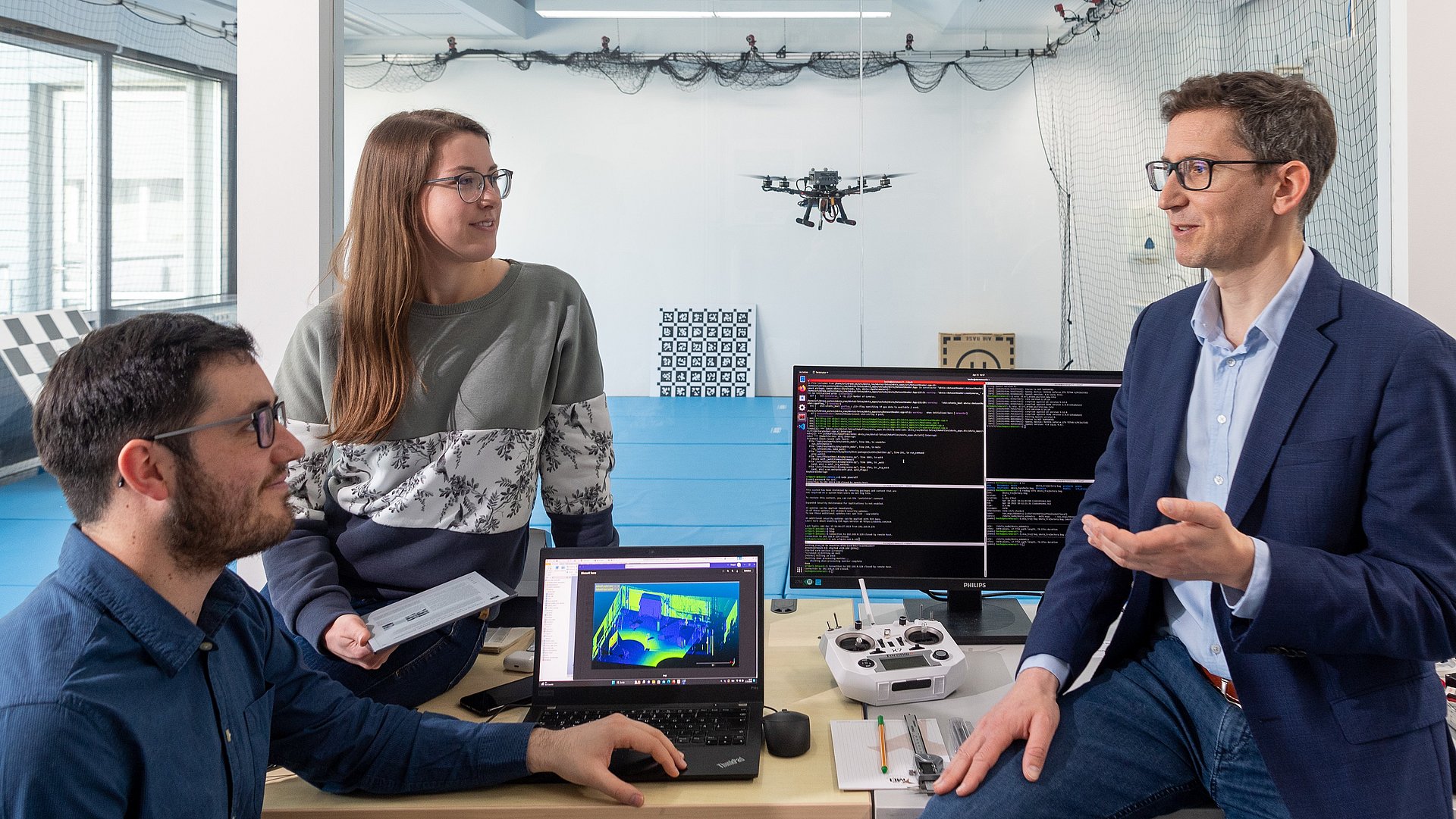 Researchers in a robotics laboratory.