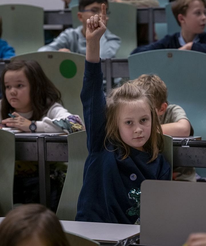 Girl raises her hand for a question