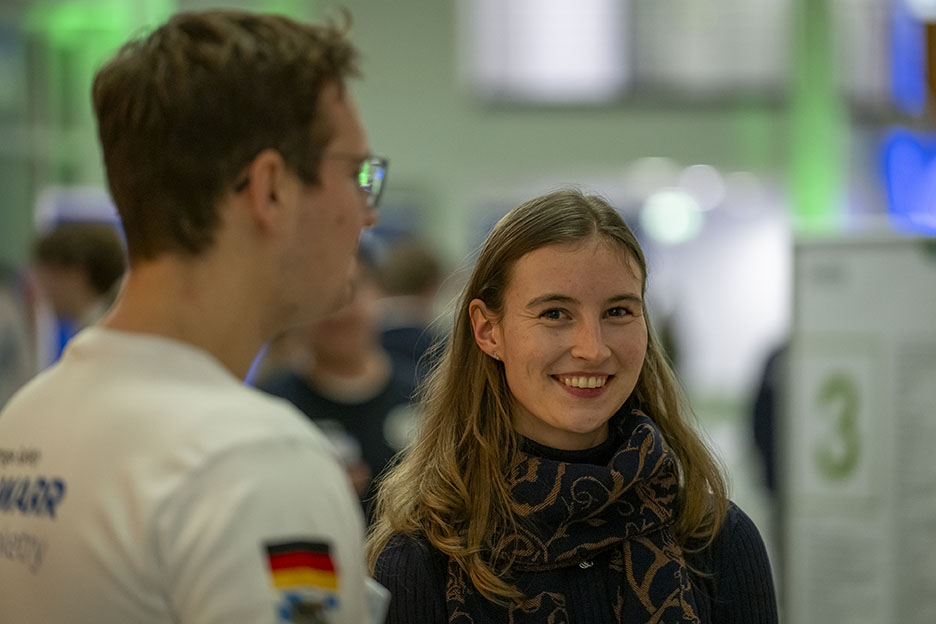 A young man and a young woman in conversation